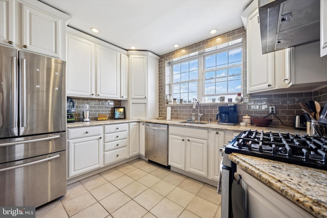 2935 S 13th St, Philadelphia, PA 19148 - kitchen featuring stainless steel appliances, a sink, backsplash, white cabinets, and recessed lighting