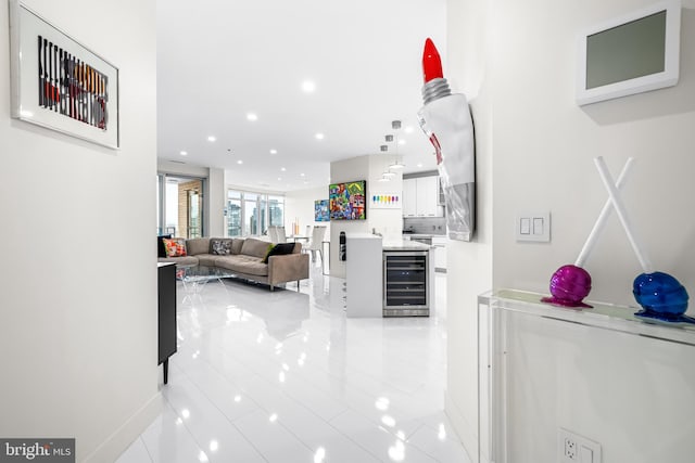 100 Harborview Dr Unit 2107, Baltimore, MD 21230 - corridor with beverage cooler, recessed lighting, baseboards, and light tile patterned flooring