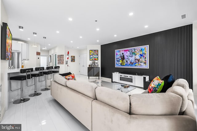 100 Harborview Dr Unit 2107, Baltimore, MD 21230 - living area with an accent wall, recessed lighting, and light tile patterned floors