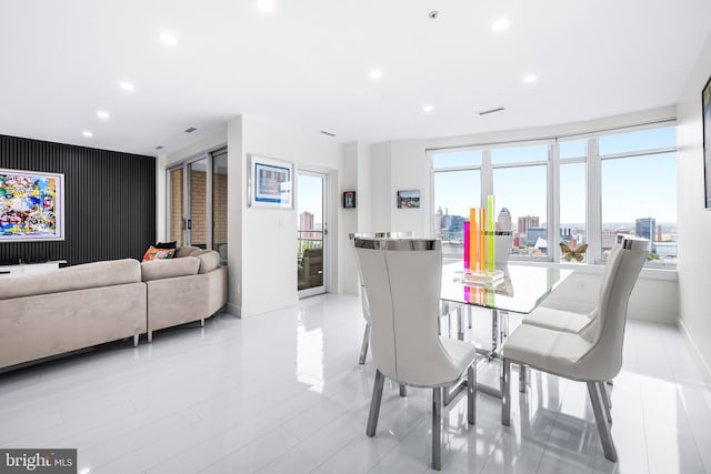 100 Harborview Dr Unit 2107, Baltimore, MD 21230 - dining room featuring healthy amount of natural light, recessed lighting, an accent wall, and baseboards
