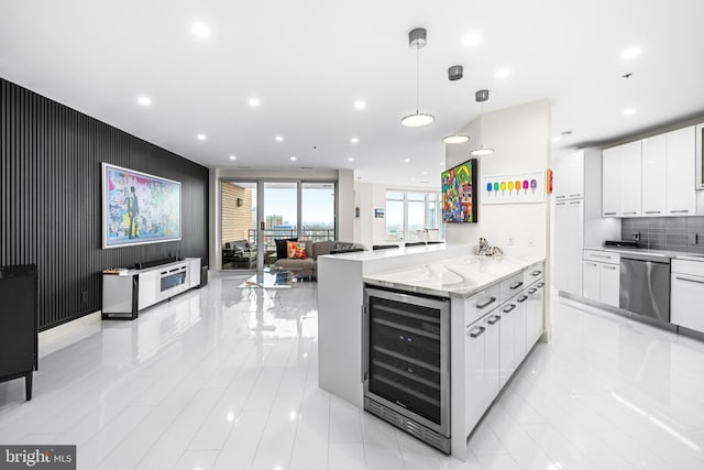 100 Harborview Dr Unit 2107, Baltimore, MD 21230 - kitchen featuring beverage cooler, stainless steel dishwasher, white cabinetry, recessed lighting, and hanging light fixtures