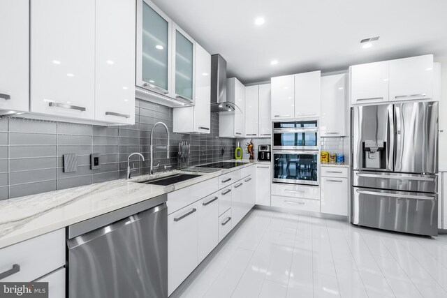 100 Harborview Dr Unit 2107, Baltimore, MD 21230 - kitchen featuring stainless steel appliances, wall chimney exhaust hood, a sink, modern cabinets, and recessed lighting