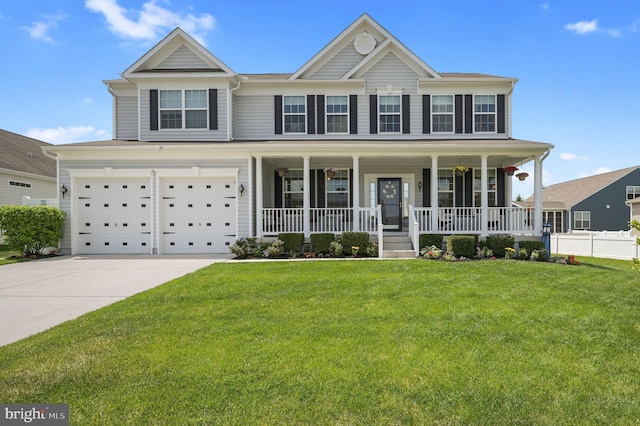 view of front of house with a porch, a garage, a front lawn, and driveway