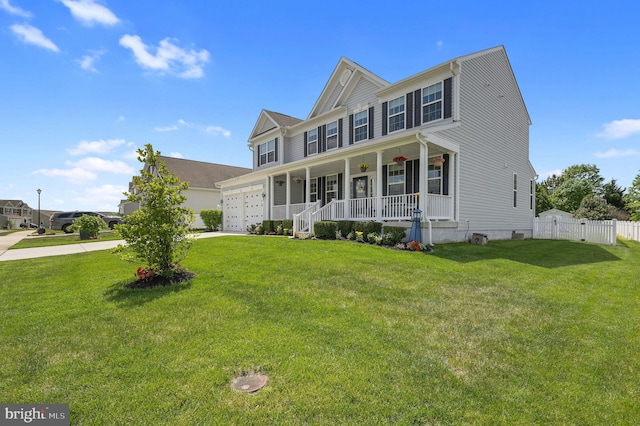 view of front of house featuring fence, covered porch, a garage, concrete driveway, and a front yard