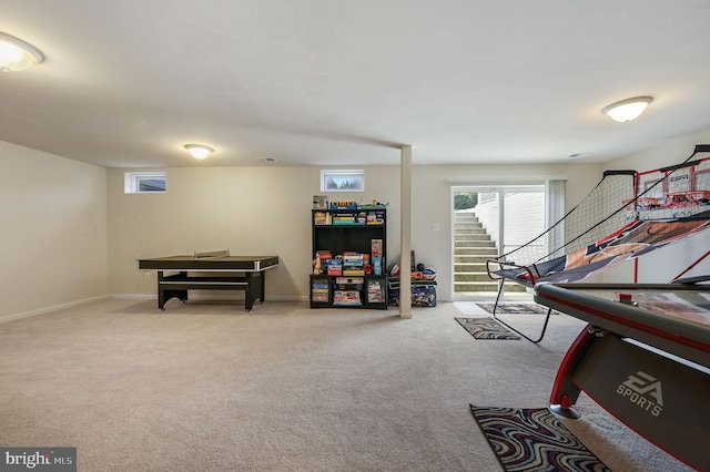 recreation room featuring baseboards and carpet floors