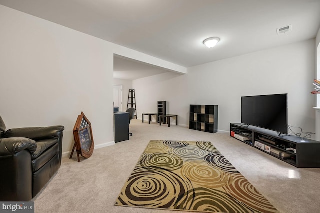 living room featuring carpet, visible vents, and baseboards