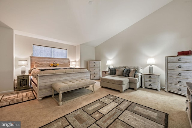 bedroom featuring light colored carpet and baseboards