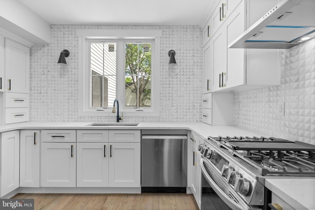 14 Titus Ave, Lawrence, NJ 08648 - kitchen featuring appliances with stainless steel finishes, under cabinet range hood, a sink, and light countertops