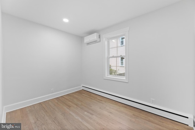 14 Titus Ave, Lawrence, NJ 08648 - spare room featuring baseboard heating, an AC wall unit, wood finished floors, baseboards, and recessed lighting