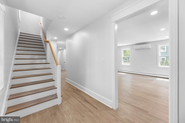 14 Titus Ave, Lawrence, NJ 08648 - staircase with a wall mounted air conditioner, baseboard heating, wood finished floors, baseboards, and recessed lighting