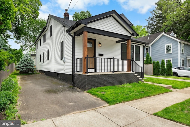 14 Titus Ave, Lawrence, NJ 08648 - shotgun-style home featuring a porch and a chimney