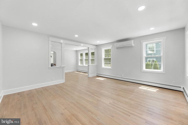 14 Titus Ave, Lawrence, NJ 08648 - empty room with an AC wall unit, a baseboard radiator, light wood-style flooring, recessed lighting, and baseboards