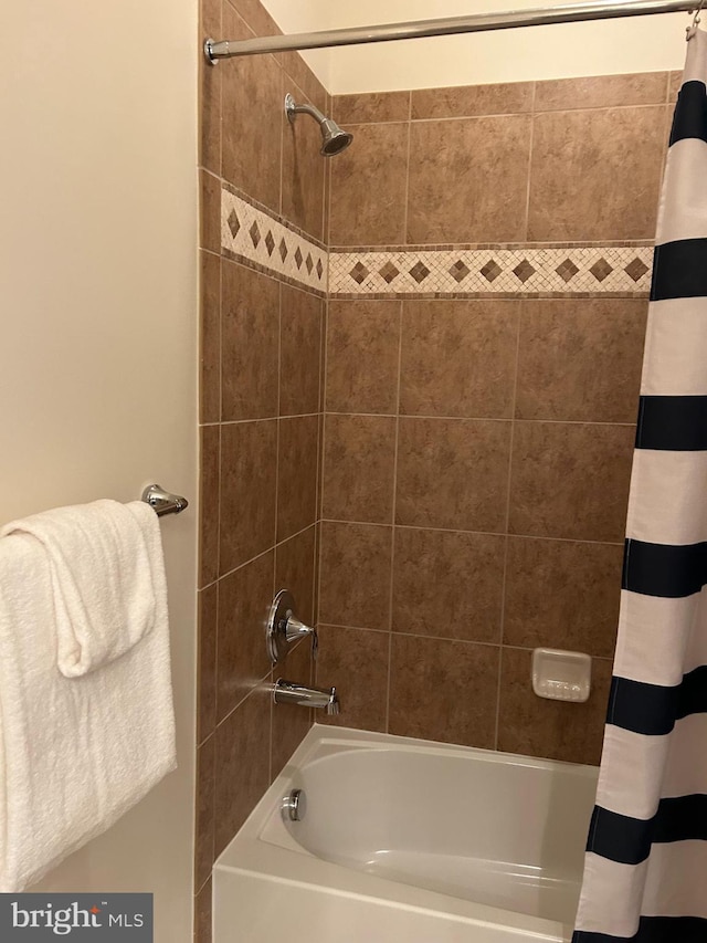 full bathroom with shower / bath combo with shower curtain