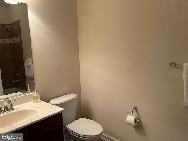 full bathroom with a shower, toilet, and vanity
