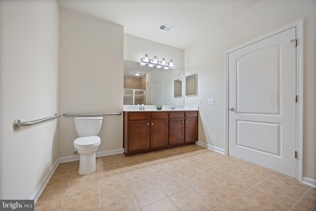 full bath with a shower stall, toilet, tile patterned floors, double vanity, and baseboards