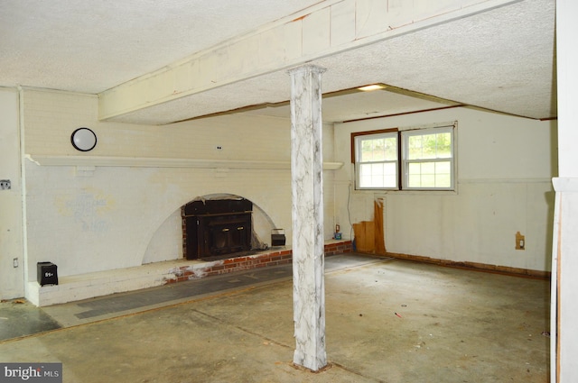8814 Lafayette Dr, Owings, MD 20736 - unfurnished living room featuring unfinished concrete flooring and a textured ceiling