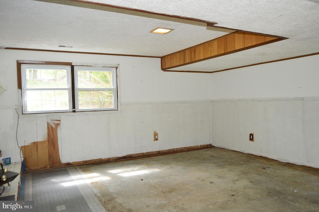 8814 Lafayette Dr, Owings, MD 20736 - below grade area featuring ornamental molding and a textured ceiling