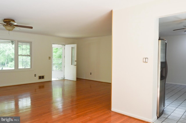 8814 Lafayette Dr, Owings, MD 20736 - spare room featuring ceiling fan, light wood-style flooring, and baseboards