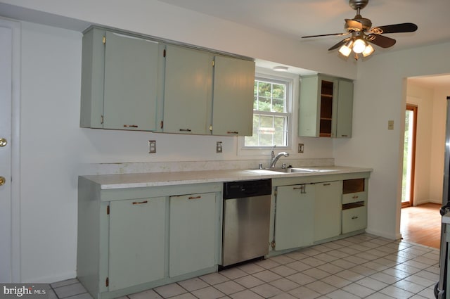 8814 Lafayette Dr, Owings, MD 20736 - kitchen with stainless steel dishwasher, light countertops, light tile patterned floors, and a ceiling fan