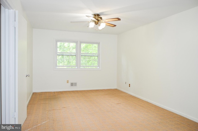 8814 Lafayette Dr, Owings, MD 20736 - empty room with ceiling fan, light carpet, and baseboards