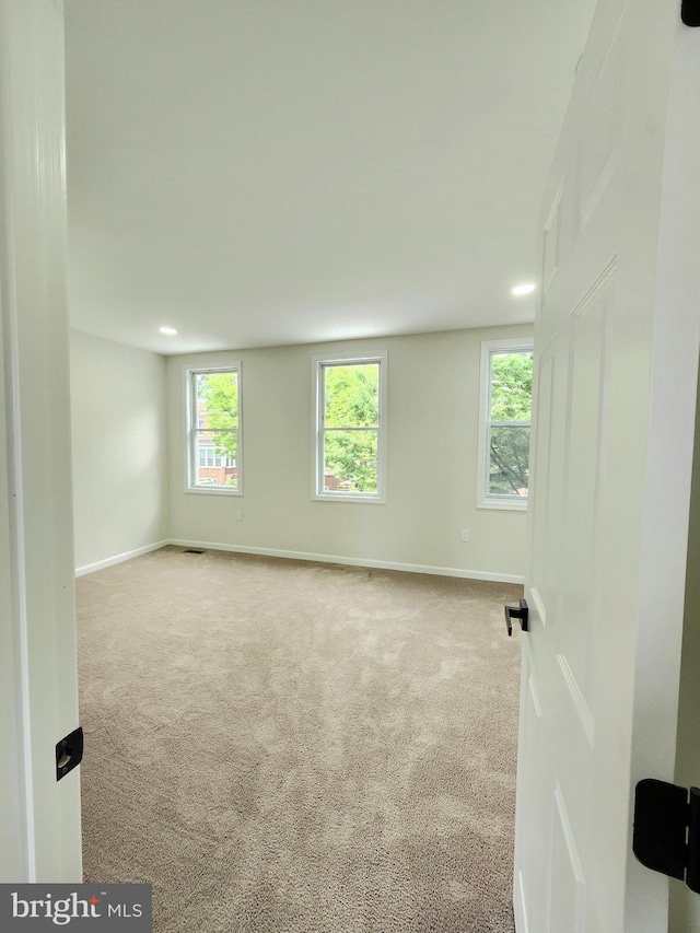 unfurnished room featuring baseboards, recessed lighting, and carpet floors
