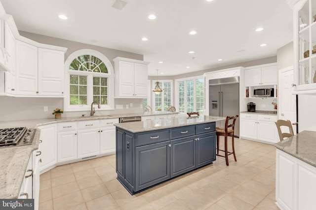 13457 Charolais Ct, Highland, MD 20777 - kitchen with stainless steel appliances, white cabinets, a sink, gray cabinets, and recessed lighting