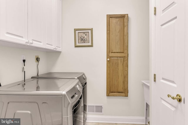 13457 Charolais Ct, Highland, MD 20777 - washroom with cabinet space, independent washer and dryer, and baseboards