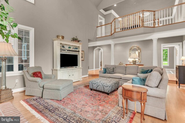 13457 Charolais Ct, Highland, MD 20777 - living room featuring a towering ceiling, wood finished floors, baseboards, and recessed lighting