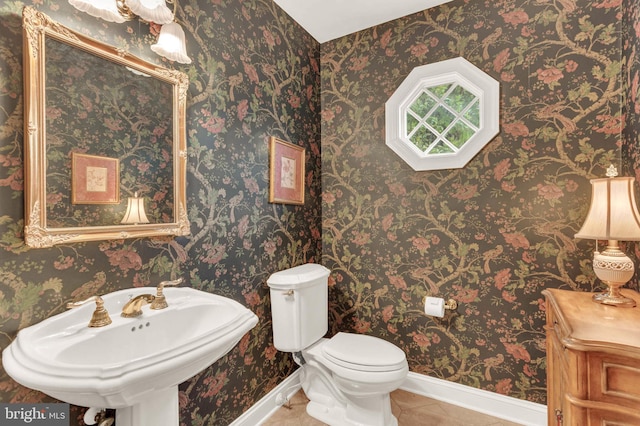 13457 Charolais Ct, Highland, MD 20777 - half bath featuring tile patterned floors, toilet, baseboards, and a sink