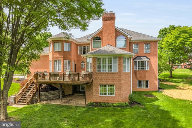 13457 Charolais Ct, Highland, MD 20777 - back of property with a chimney, brick siding, a wooden deck, and a yard