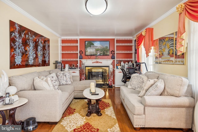 living room featuring crown molding, wood finished floors, and a high end fireplace