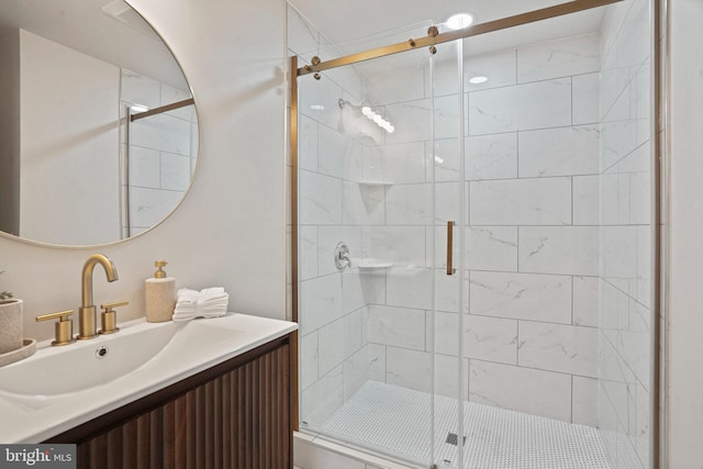 bathroom with vanity and a shower stall