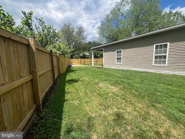 view of yard featuring a fenced backyard