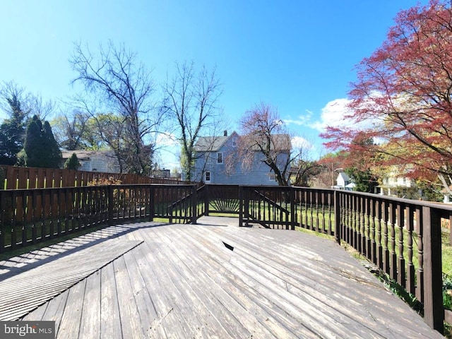 wooden terrace featuring fence private yard