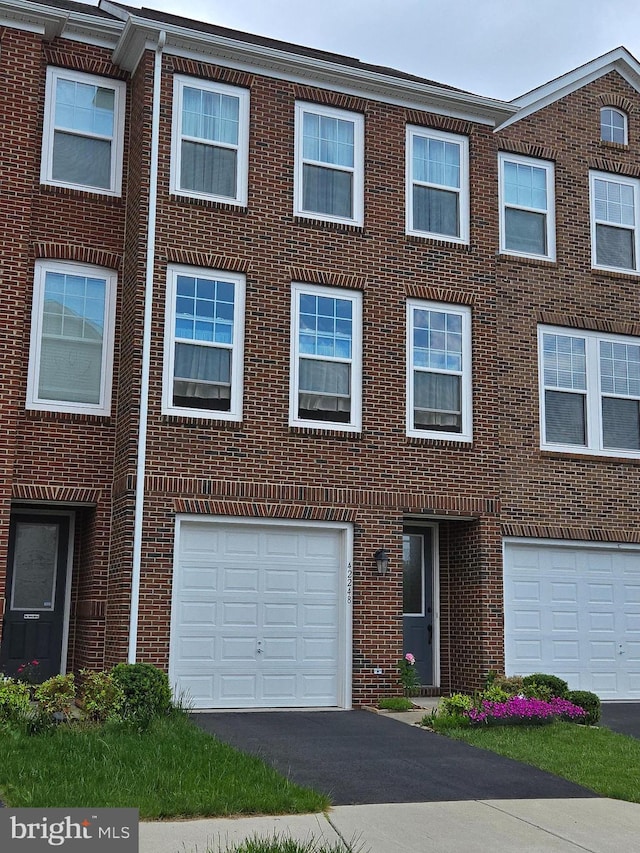 42248 Lancaster Woods Sq, Chantilly, VA 20152 - multi unit property with brick siding, driveway, and a garage