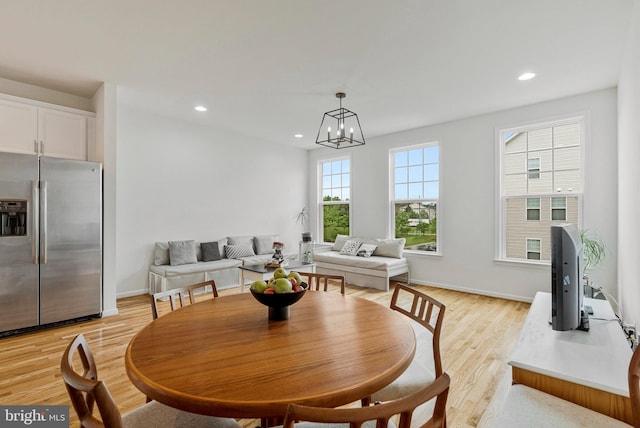 42248 Lancaster Woods Sq, Chantilly, VA 20152 - dining area featuring light wood finished floors, a chandelier, recessed lighting, and baseboards