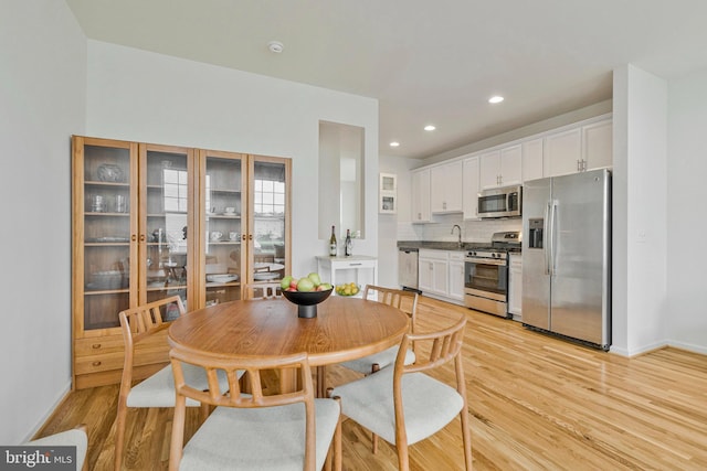 42248 Lancaster Woods Sq, Chantilly, VA 20152 - dining space featuring light wood-type flooring, baseboards, and recessed lighting
