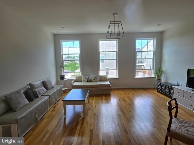 42248 Lancaster Woods Sq, Chantilly, VA 20152 - living room with plenty of natural light, wood finished floors, and baseboards