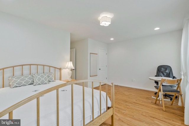42248 Lancaster Woods Sq, Chantilly, VA 20152 - bedroom with light wood-style floors, recessed lighting, and baseboards
