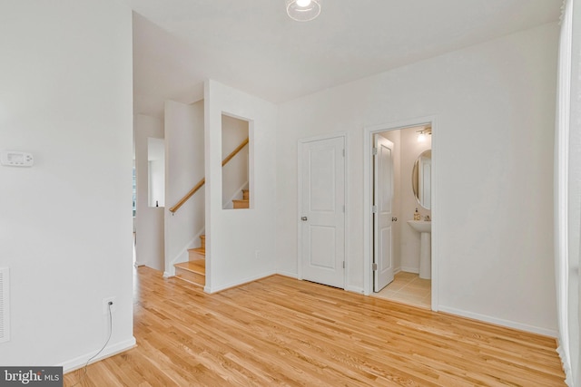 42248 Lancaster Woods Sq, Chantilly, VA 20152 - spare room featuring light wood-type flooring, stairs, and baseboards