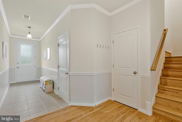 42248 Lancaster Woods Sq, Chantilly, VA 20152 - foyer featuring ornamental molding, stairs, baseboards, and light tile patterned flooring