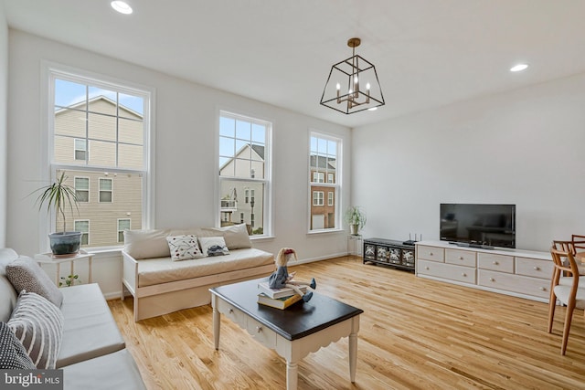 42248 Lancaster Woods Sq, Chantilly, VA 20152 - living area with wood finished floors, a chandelier, recessed lighting, and baseboards