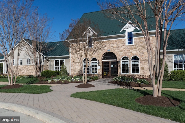 42248 Lancaster Woods Sq, Chantilly, VA 20152 - view of front of property featuring stone siding, a front lawn, metal roof, and a standing seam roof