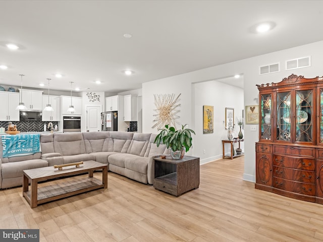 32019 Carlisle Ct, Frankford, DE 19945 - living area with light wood finished floors, baseboards, and recessed lighting