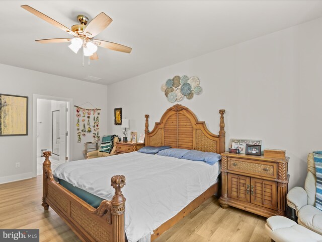 32019 Carlisle Ct, Frankford, DE 19945 - bedroom featuring light wood finished floors, a ceiling fan, connected bathroom, and baseboards