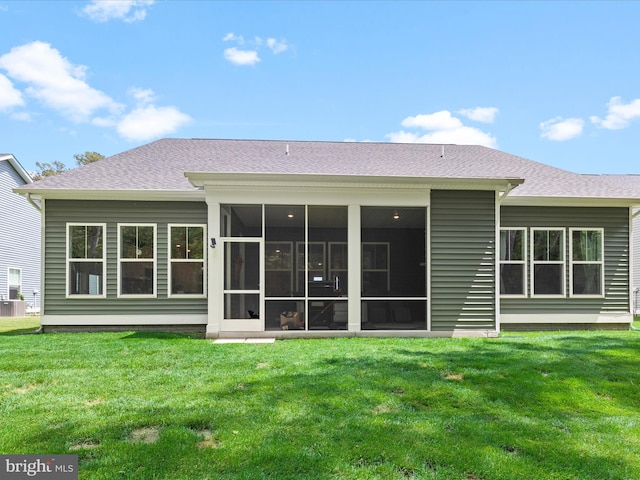 32019 Carlisle Ct, Frankford, DE 19945 - back of property with a lawn, a sunroom, and roof with shingles