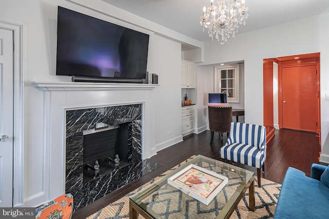 44 Nassau St Unit A, Princeton, NJ 08542 - living area featuring baseboards, a high end fireplace, a chandelier, and dark wood-type flooring