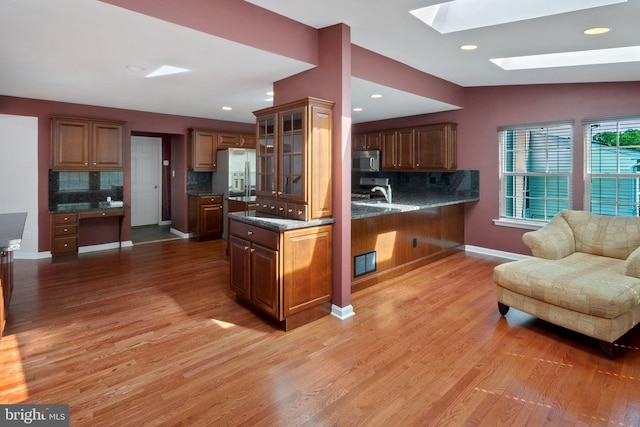 2 Raydan Way N, East, MD 21901 - kitchen featuring stainless steel microwave, a skylight, backsplash, light wood finished floors, and recessed lighting