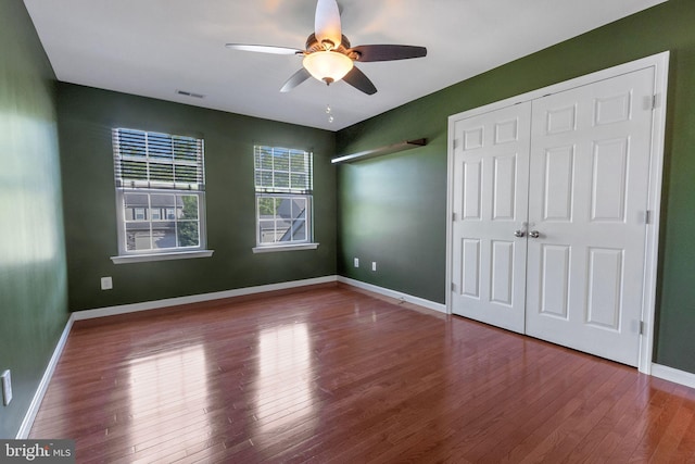 2 Raydan Way N, East, MD 21901 - unfurnished bedroom with wood finished floors, a closet, baseboards, and a ceiling fan