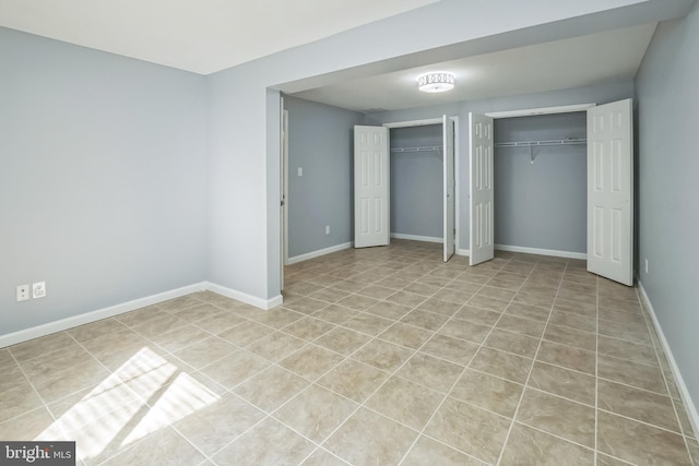 2 Raydan Way N, East, MD 21901 - unfurnished bedroom featuring multiple closets, tile patterned floors, and baseboards